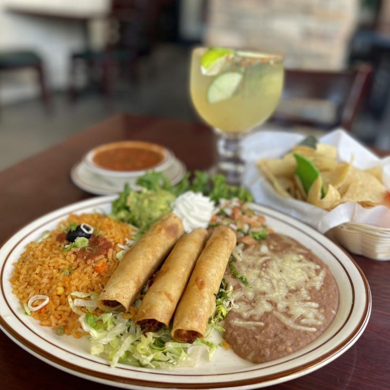 Plate of mexican food with margarita at Patron's Mexican Bar and Grill restaurant.