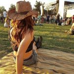 Person sitting down at Boots & Brews country concert at Central Park in Santa Clarita.