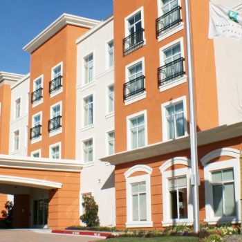 Front view of Embassy Suites by Hilton hotel in Valencia, California.