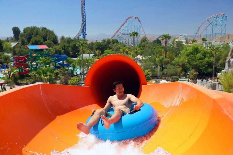 Person going down a waterside in a tube at Six Flags Hurricane Harbor.