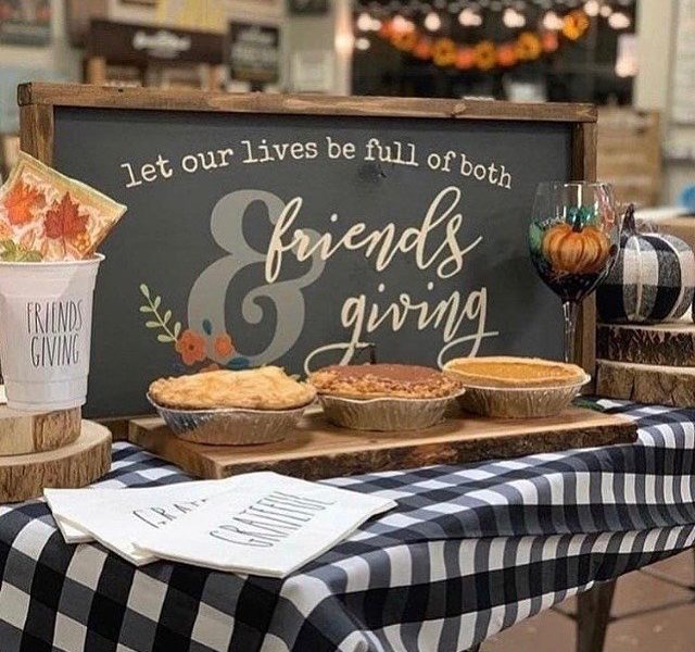Friendsgiving-themed wood display sign on table at Board & Brush Creative Studio.