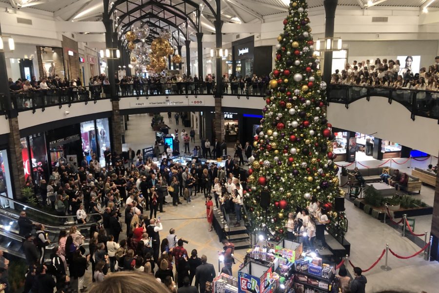 Christmas tree display with large crowd inside of local shopping area in Santa Clarita.